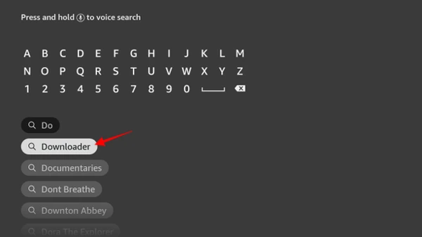 Typing Downloader in the Firestick search bar to find the sideloading tool